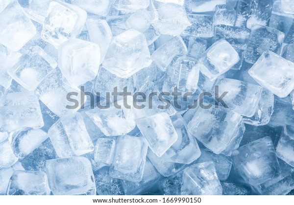 Crystal clear ice\
cubes as background, top\
view