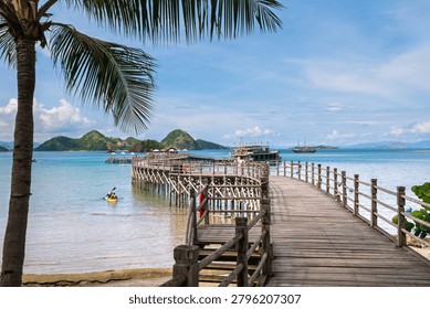 Crystal clear infinity pool featuring submerged loungers and turquoise water at a tropical resort. Travel background with copy space for tourism, vacation, hospitality advertising and banner design.
