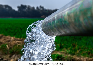 crystal clear sweet and healthy water being flush out by a heavy diesel engine tube well  in the wheat fields where the river water can't reach 