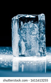 Crystal Clear Transparent Shiny Ice Block, Isolated On Black Background.