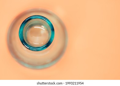 A Crystal Flower Vase Isolated On A Pastel Orange Background With Free Space For Text