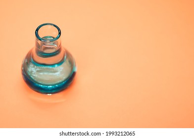 A Crystal Flower Vase Isolated On A Pastel Orange Background With Free Space For Text