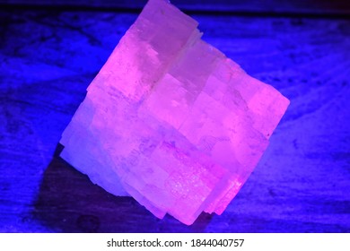 Crystal Fluorescing Pink Under A UV Light.