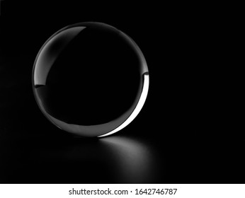 Crystal Glass Ball Sphere Transparent Isolated On Dark Background.