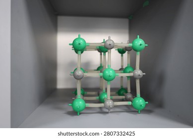 Crystal lattice model representing materials science, nanotechnology and molecular engineering. Scientific research concept related to chemistry, physics, advanced materials and innovation.