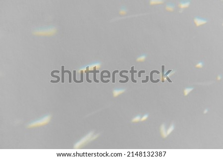 .Crystal light reflections for overlay mockup on light background. Rainbow holographic shadow mock up, iridescent prismatic wallpaper. Abstract prism reflection, rays leaking through lens effect.