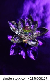 Crystal Lotus On Shiny Dark Purple Table. Stone Flower With Light Reflect. Sahasrara Chakra Symbol.