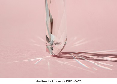 Crystal Prism With Light Diffraction Of Spectrum Colours And Reflection With Trendy Light And Hard Shadows On Pink Background. Light Spectrum Reflected Through Glass Prism. Banner