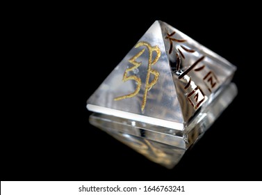 Crystal In Pyramid Shape With REIKI Symbols : Cho Ku Rei  Means Power, Sei Hei Ki Means Harmony, Hon Sha Ze Sho Nen Means  Distance, Dai Ko Myo Means Master, Raku =completion