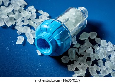 The crystal salt for the system of filtration of water on a blue background