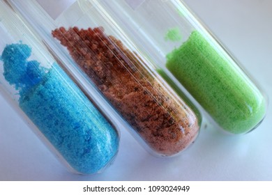 Crystal Salts Hydrates In Test Tubes: Blue Copper Sulfate, Brown Cobalt Sulfate, Green Nickel Chloride.