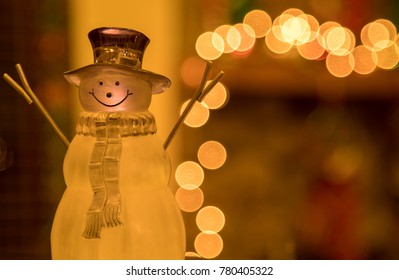 Crystal Winter Time Holiday Snowman in Front of a Decorated Fireplace Mantle 
