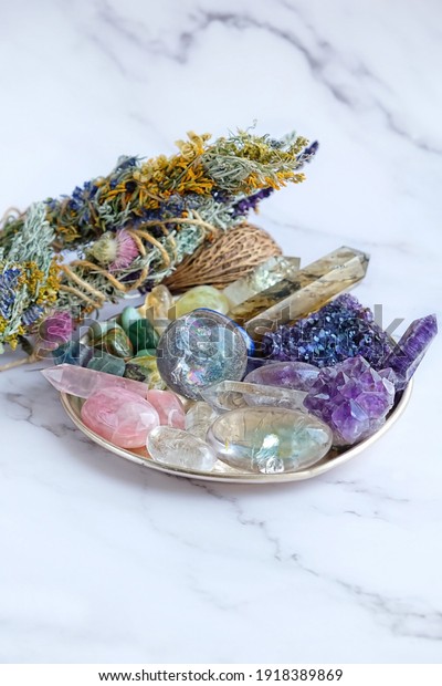 Crystals Stones Set.\
healing gemstones minerals and floral cleansing bundles. relax\
Crystal Ritual, Esoteric life balance concept. spiritual practice.\
modern magic