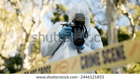 Csi, photographer and police tape at crime scene for investigation in forest with evidence and safety hazmat..Forensic quarantine, expert investigator and pictures for observation and case research