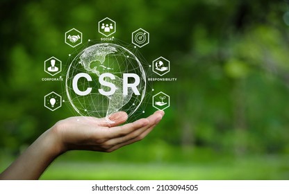 CSR icon concept in the hand for business and organization, Corporate social responsibility and giving back to the community on a green nature background. - Shutterstock ID 2103094505
