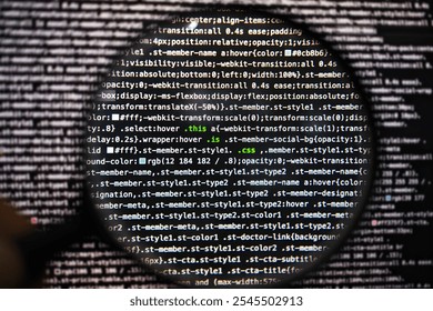 css code in magnifying glass abstract technology background