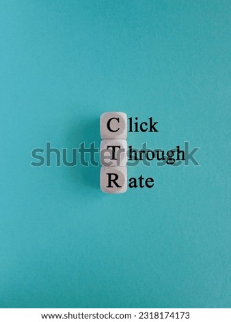 CTR click through rate symbol. Wooden cubes with words 'CTR click through rate'. Beautiful blue background. Business and CTR click through rate concept. Copy space.