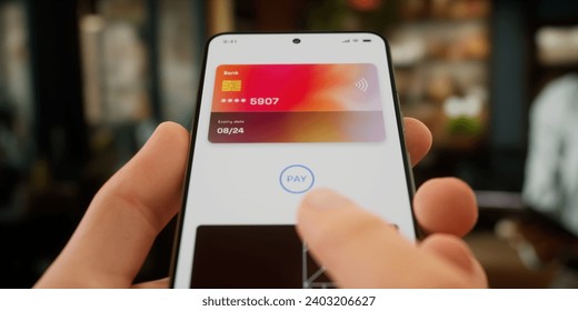 CU Man is paying with a card linked to his smartphone at the cafe using wireless NFC technology