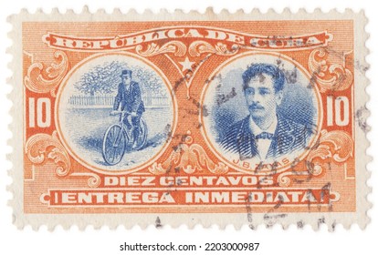 CUBA - 1910: An 10 Centavo Orange And Blue Special Delivery Stamp Showing Bicyclist Postman And Portrait Of Juan Bruno Zayas Alfonso. Cuban Military Leader And Doctor Of The Cuban War Of Independence