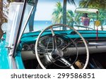 Cuba blue classic car park near the beach in havana with dashboard interior view
