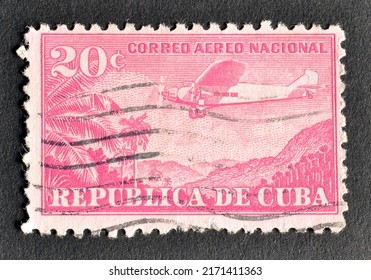 Cuba - circa 1931 : Cancelled postage stamp printed by Cuba, that shows Plane Ford 4-AT Tri-Motor over mountain landscape, circa 1931.