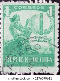 CUBA - CIRCA 1939: A Postage Stamp From CUBA , Showing A Native American Ein Ciboney Indian With Long Hair Smoking A Cigar. Circa 1939