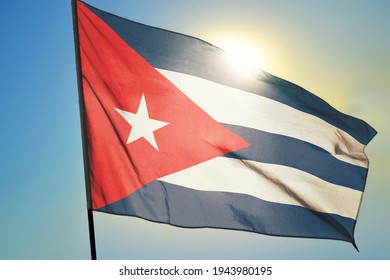 Cuba flag waving on the wind in front of sun
