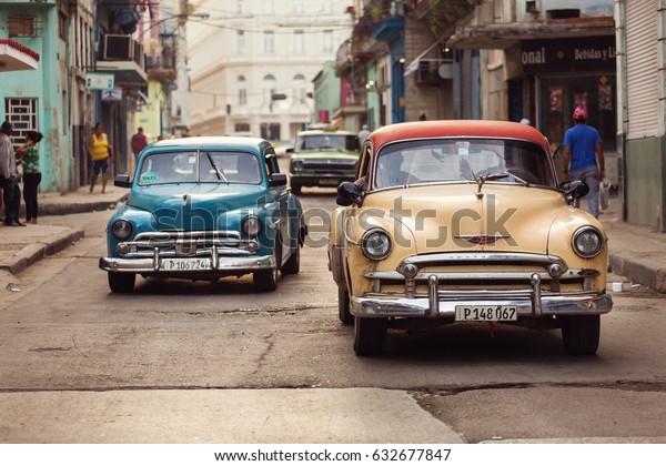 Cuba, Havana - 18 February 2017:\
beautiful retro vintage cars in the colourful streets. Cuba have\
many old american cars restaured. Editorial\
picture.