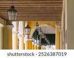 Cuba, Havana.  Archways with hanging electric lanterns, located at Ignace Street, corner Muralla street, Plaza Vieja (Old Square). 2016-03-25