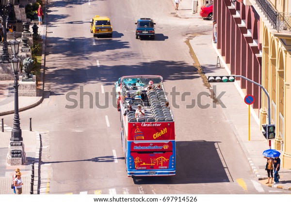 CUBA, HAVANA - MAY 5, 2017: Excursion\
bus in the city street. Copy space for text. Top\
view