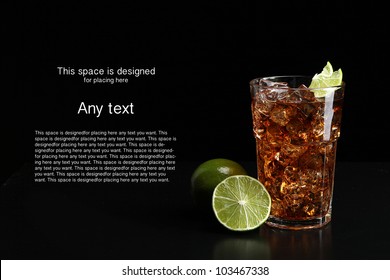 Cuba Libre Cocktail, Black Background, Ice And Lime