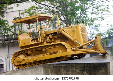 CUBA, SANTA CLARA- FEBRUARY 02, 2013: Monument To The Derailment Of The Armored Train. Caterpillar Bulldozer Used To Break The Rails

