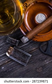 Cuban Cigar In Ashtray, Glass Of Rum On Table , From Above