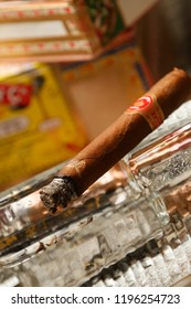 Cuban Cigar Box And Person Smoking Cigar. Habano Cigar Wrapper Is A Leaf Grown From A Cuban Seed, Hence The Word 