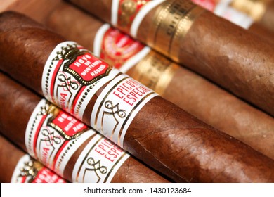 Cuban Cigars in a humidor. Romeo y Julieta (Established 1885) Short Churchill’s and Hoyo de Monterrey (Established 1865) Epicure Especial. Traditional Cuban tobacco leaf cigars. Editorial background.