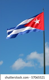 Cuban Flag  A large national flag of Cuba, fluttering in the breeze.