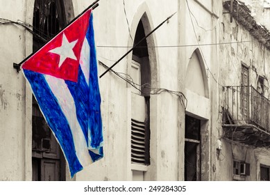 Cuban flag on a grunge decaying neighborhood