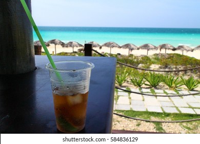 Cuban Rum On Bar With A Beach Background