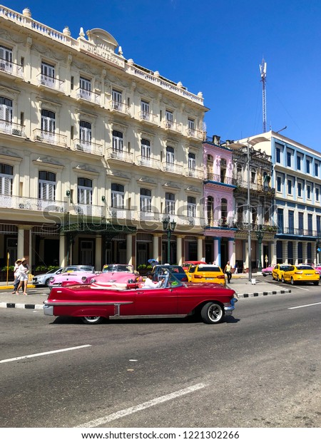 Cuban vintage car. American\
classic car drives on the main road in Old Havana, Cuba.\
10/02/2018