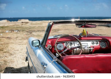 cuban vintage car parked on the seacost in havana