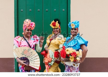 Cuban women called canasteras with habano flowers and typical costume in La Havana, Afro caribbean people in Latin America