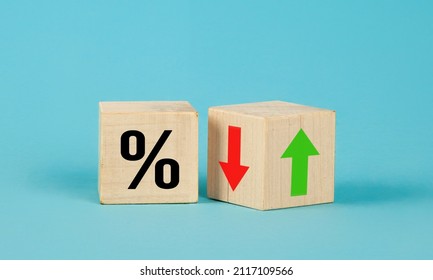 Cube block with percentage symbol icon. Interest rate financial and mortgage rates concept. Wood cube change arrow down to up. Interest rate, stocks, ranking. Business and finance concept. - Shutterstock ID 2117109566