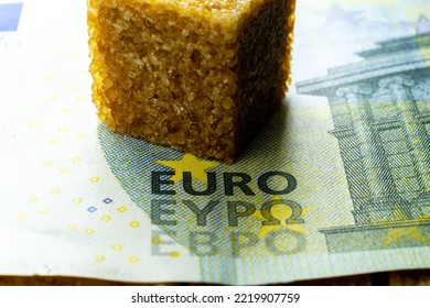 Cube Of Cane Organic Sugar Over Hubred Euro Banknote. World Food Crisis Leds To Raising Prices For Food Stocks