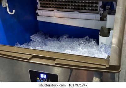 Cube Ice From Clean Water In Ice Making Machine For Restaurant Food Industry Background ; Close Up 