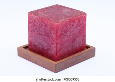 Cube Square Red Marble Candle On Teak Wood Stand, Studio Lighting White Background Isolated