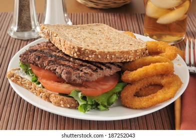 A Cube Steak Sandwich On Sprouted Whole Grain And Seed Bread