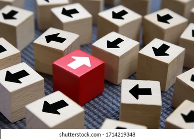 Cube Wooden Toy Blocks With Arrow Opposite Each Other. Concepts Of Organizational Change To Business Adapting.