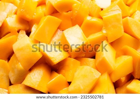 Cubed mango background, close-up, mango background, top view