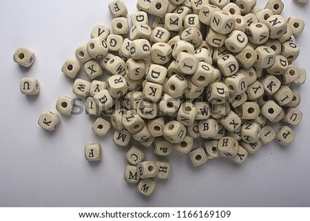 cubes beads letters alphabet / background of wooden cubes with alphabet letters, concept education reading, learning letters