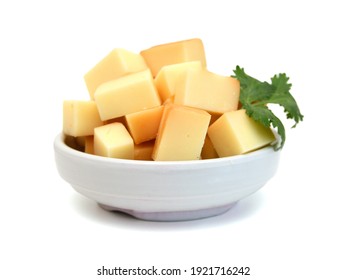 Cubes Of Cheddar Cheese Isolated In Bowl  On White 